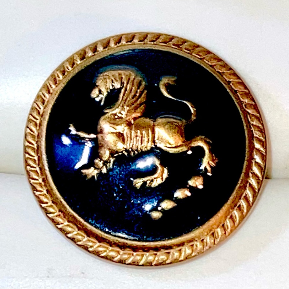Large gold tone black enamel Rampant Lion vintage button